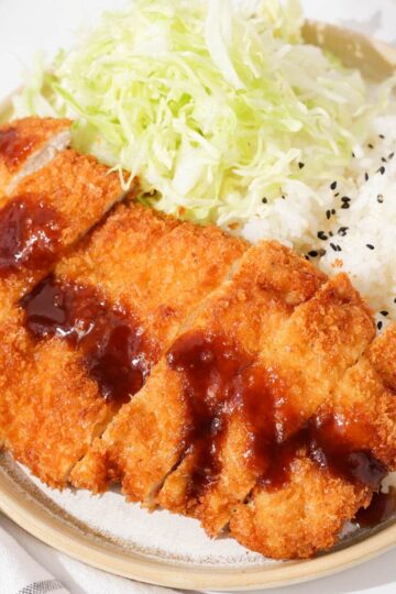 Chicken katsu on a plate.