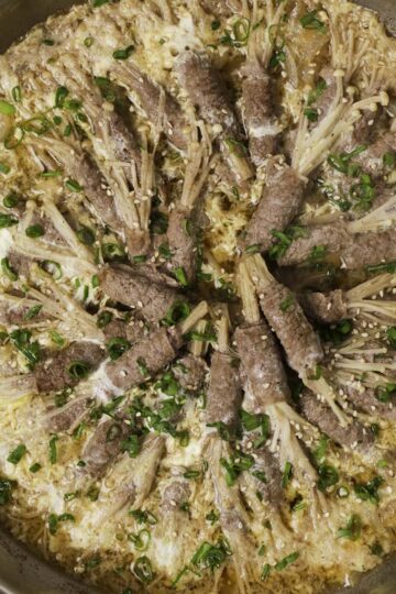 A pan of enoki beef rolls.
