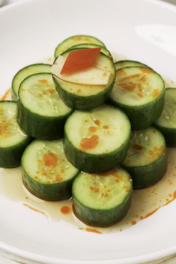 A stack of cucumbers on a plate just like Din Tai Fung.