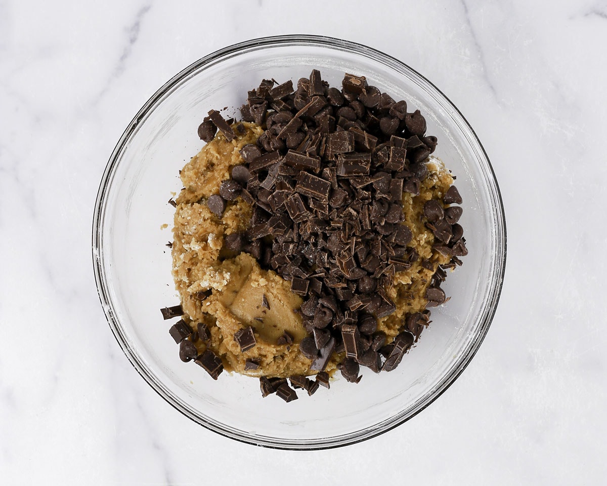 Chocolate chips and chopped chocolate added to cookie dough.