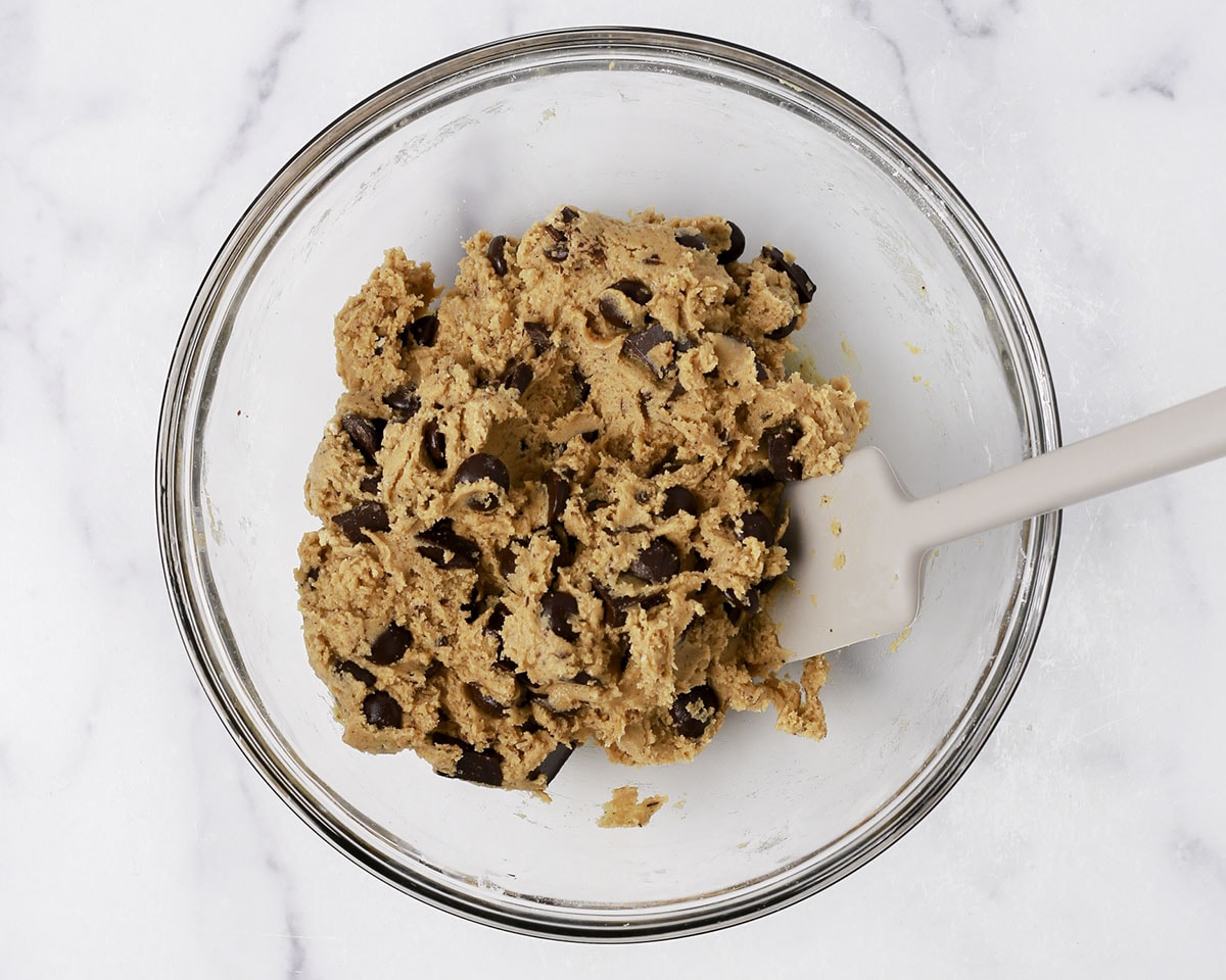 Brown butter chocolate chip cookie batter in a bowl.